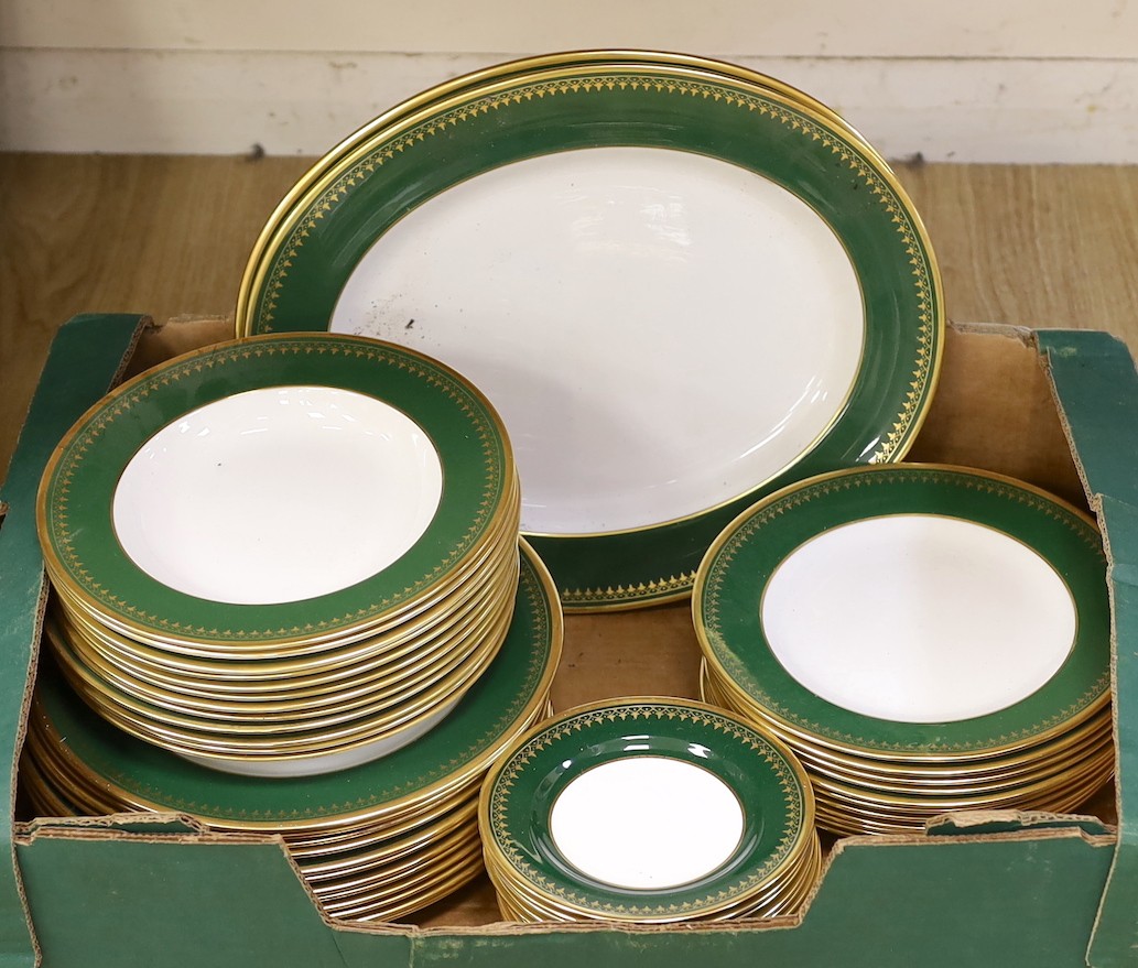 A Spode green and gold banded dinner set